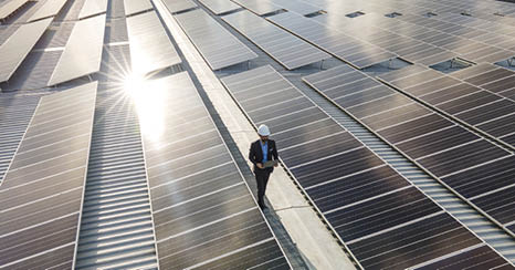 Electrical engineers are using laptops to monitor the operation of the solar rooftop. Renewable energy concepts