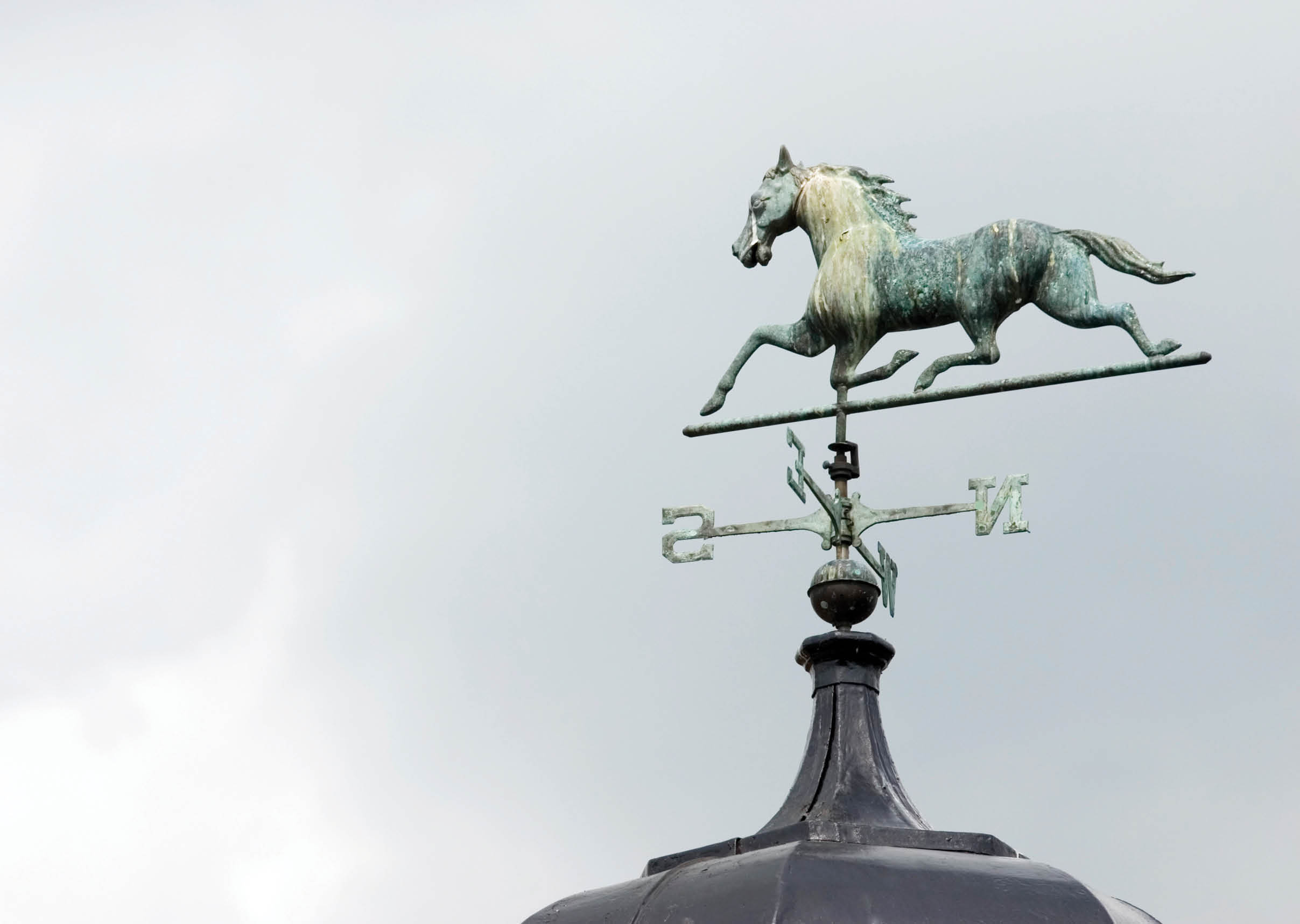 Galloping Horse, heading south, on a weather vane located on a stud farm rooftop  Plenty of copy space 